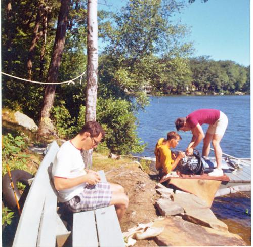 1968 August 11 Fixing the boat motor When the propellar pin was blown out Van Billings Greg Persbacker Ted in red shirt