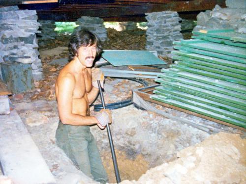 1975 August 19 Ted digging for new post under house at Lake T